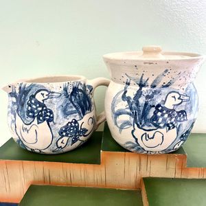 Art Pottery Creamer and Lidded Sugar Bowl Geese Blue White Speckle Finish Signed